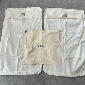 Two Gucci Garment Bags and a Fendi Pouch